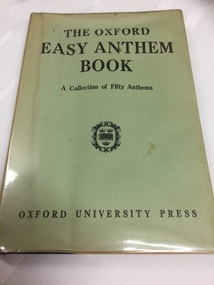 A green plastic covered Oxford Easy Anthem book with the title printed in large black letters at the top of the cover.