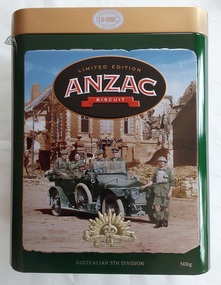 A medium sized rectangular Limited Edition green and gold lidded Anzac Biscuit Tin with an old brown and grey toned photograph image of soldiers.