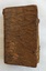 A badly damaged small antique brown leather Lutheran German Missal. 