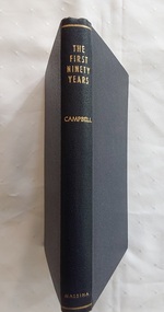 A navy blue hardcover book with the title The First Ninety Years.