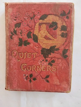 A damaged red antique hardcover book for girls with the title printed in gold lettering in the middle of the front cover. 