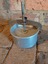 A small vintage round clip on lidded aluminium food press possibly used for pressed tongue. 