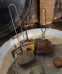 Three vintage wire mesh dish or clothes washing soap savers with a rectangular basket.