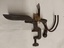 A cast iron and wood dual cherry pitter which can be mounted to a table or bench.