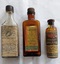 Four glass medicinal bottles: Eucalyptus Oil, Camphorated Oil, Friars Balsam, Eucalyptus Oil