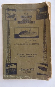 A khaki softcover reader titled: The Modern World Geographies, Europe, Africa and South America Grade VII or Form F. 
