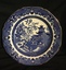 A blue and white Willow Pattern scalloped edged dessert plate with a fine gold line around the outer edge.