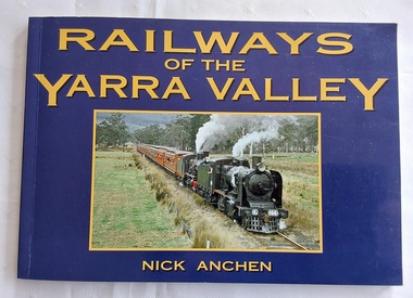 A blue covered book of the Railways of the Yarra Valley with a photograph on the front cover of the last steam train from Warburton in August 1965.