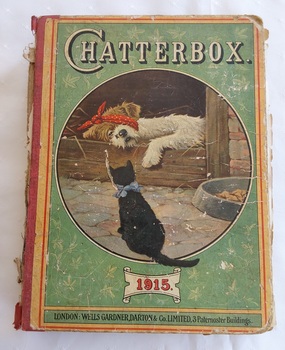 A badly damaged vintage 1915 hardcover children's book with the title Chatterbox printed in white lettering at the top of the front cover.