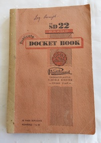 A small pink front covered docket book with REF. SD Brand printed at he top and Duplicate Docket Book underneath.