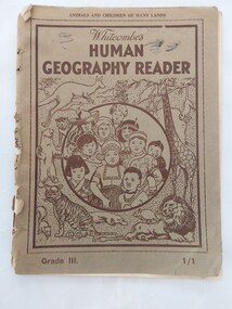 A faded green paperback reader or textbook with faded black lettering on the front cover at the top for the title Whitcombe's Human Geography Reader. Grade III.