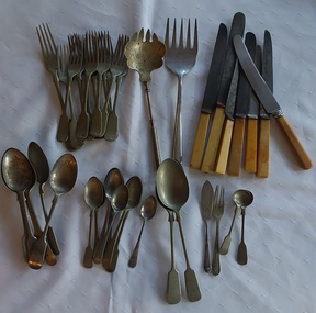 Assorted very worn kitchen cutlery for every day use by the family. 