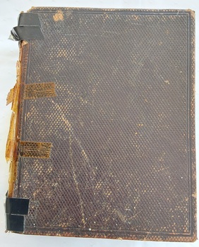 Brown's Self-Interpreting Family Bible. A thick dark brown volume with a tiny embossed diamond shaped self-pattern on both covers.