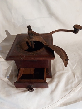 A square wooden and metal antique hand operated French coffee grinder mill.