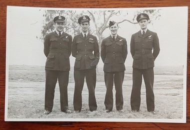 A small black and white photograph of Max Proctor in a group of four air crew including Max on the far right. 