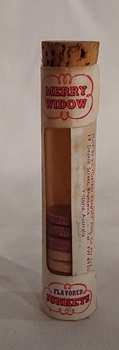 A small glass Merry Widow brand vial of rennet tablets used to make the milk-based dessert junket.