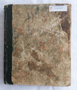 A green marbled paper covered hardcover school homework book which belonged to Ms Beryl Jacquier. 