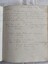 A green marbled paper covered hardcover school homework book which belonged to Ms Beryl Jacquier. 