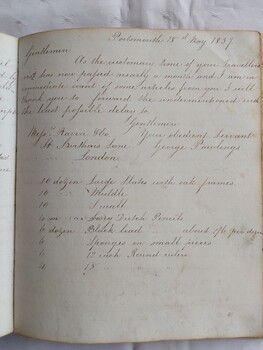 A green marbled paper covered hardcover school homework book which belonged to Ms Beryl Jacquier. 