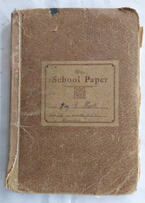 11 paper children's monthly magazines held by string inside a faded brown cardboard The School Paper cover.