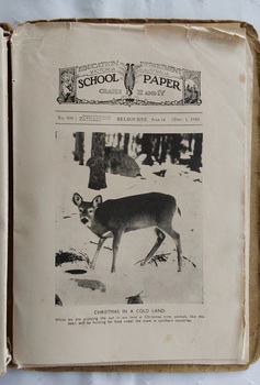11 paper children's monthly magazines held by string inside a faded brown cardboard The School Paper cover.