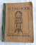A very damaged brown softcover book with the title, Second Book of the Victorian Readers printed in black lettering on the front cover.