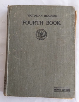 A badly damaged grey fabric covered hardcover Victorian reader Fourth Book.