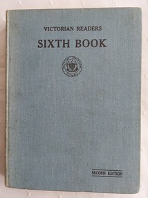 A pale blue fabric covered hardcover with the title Victorian Reader Sixth Book, printed in black lettering at the top of the front cover.