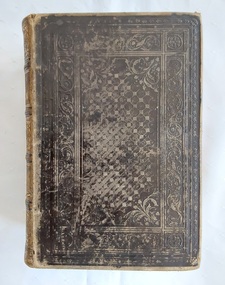 A thick, brown leather hardcover vintage book, The Practical Home Physician and Encyclopedia of Medicine.
