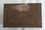 A rusty small metal empty vintage brown and black patterned rectangular lidded old tin which contained Seidlitz Powders. 