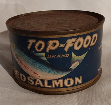 An old unopened tin of Top-Food brand red salmon.