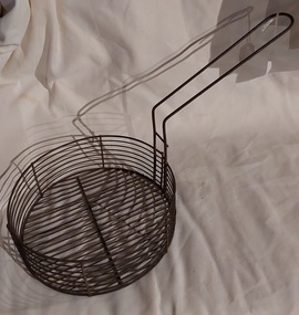 A medium sized vintage wire fish and chip fryer from the 1950's. 