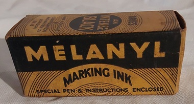 An empty yellow and black Melanyl Marking Ink cardboard box.