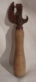 A dual metal can and bottle opener with a decorative line on the turned wooden handle. 