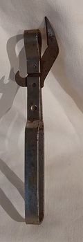 A dual hand held metal can and bottle opener.