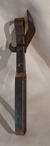 A dual hand held metal can and bottle opener.