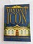 Three volumes of the book Lilydale Icon - A History of Lilydale's Athenaeum Building with covers of different coloured backgrounds.