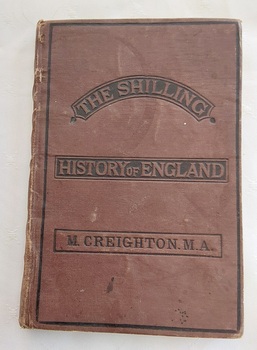 A small brown hardcover book with the title, The Shilling History of England stamped into the front cover in brown lettering.