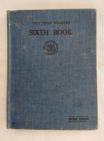 A dark blue fabric covered hardcover with the title Victorian Reader Sixth Book.