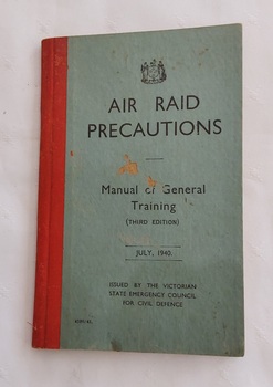 A small vintage blue covered book - Air Raid Precautions Manual of General Training.