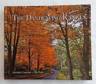 A colourful covered book showing a road winding through the beautiful autumn trees in the Dandenong Ranges approximately 40km from Melbourne.