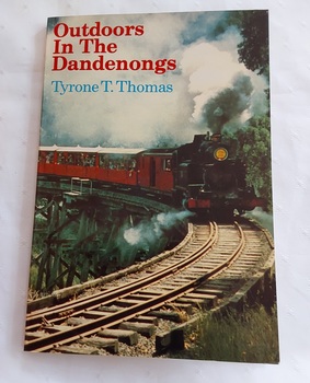 This book has a colourful front and back full cover photograph of the tourist train, Puffing Billy, with the title, and author. 