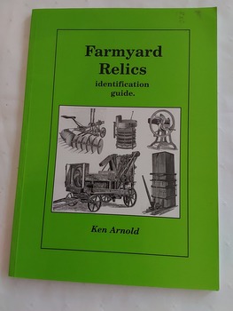 A green covered book with the title and author printed in black print with a large black and white illustration of old machinery used on farms in the past.