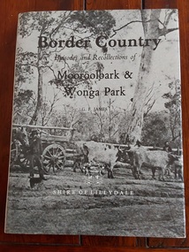 A brown book with a grey dust jacket featuring an old photograph of a bullock team and wagon, Birt's Hill, Brushy Creek.