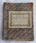A badly worn brown and blue marbled style coloured covered Nature Study Exercise book for student use in schools. 