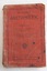 A red covered Arithmetic book for Grade VI with the title, editor and publisher details enclosed by a border of black lines at the edges of the front cover. 