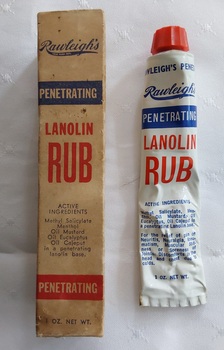 A box containing a white, red and blue 1oz. tube of Rawleigh's penetrating Lanolin Rub for the relief of various external pain. 