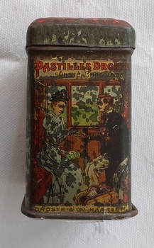 A tiny vintage lidded Pastille Droste Cacao tin featuring the lithographic art of Droste's Cacao and chocolate. 