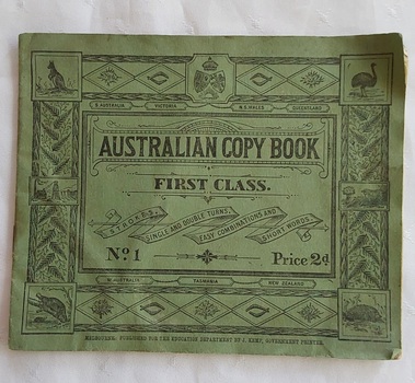 A slim green Australian Copy Book First Class. No.1 Price 2d. printed on the ornate front cover. 