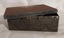 A rusty small metal empty vintage brown and black patterned rectangular lidded old tin which contained Seidlitz Powders. 